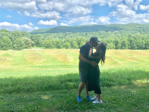 Sara and Erik kissing at Storm King Art Center after proposal