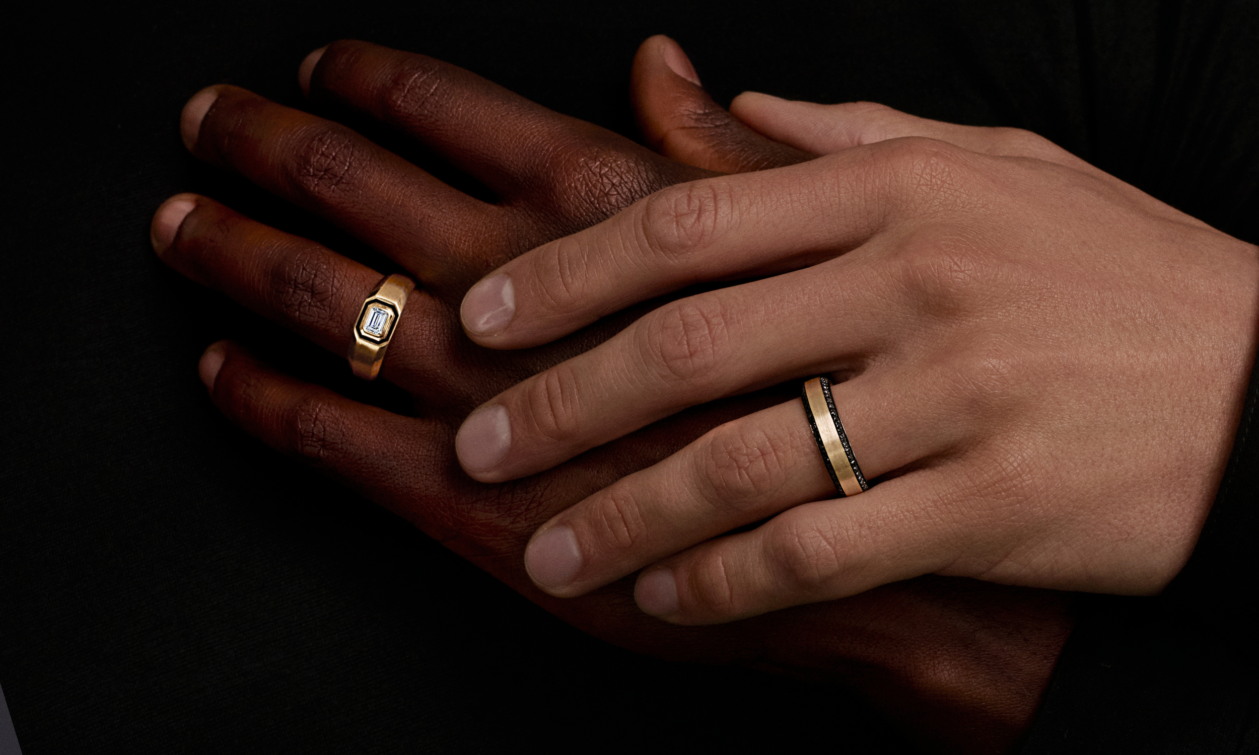 hands holding eachother wearing wedding bands
