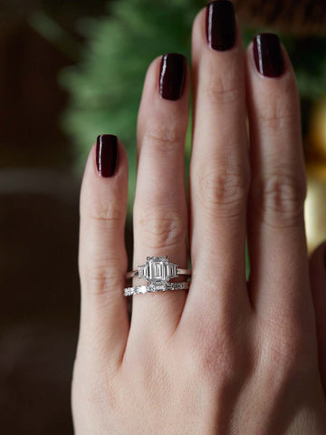 Platinum engagement ring on hand
