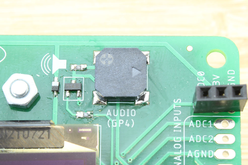 Close up image of piezo buzzer on board