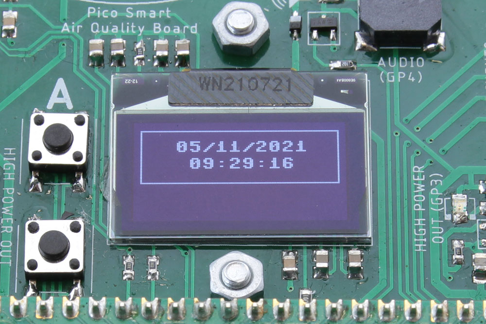 Close up image of OLED screen showing date and time with border box