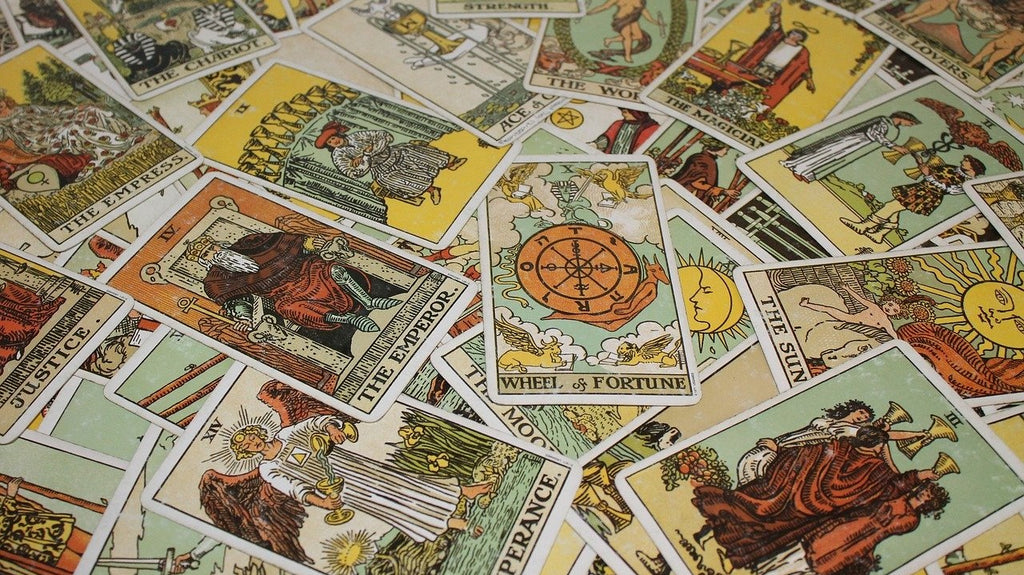 Dozens of colorful gypsy tarot cards.