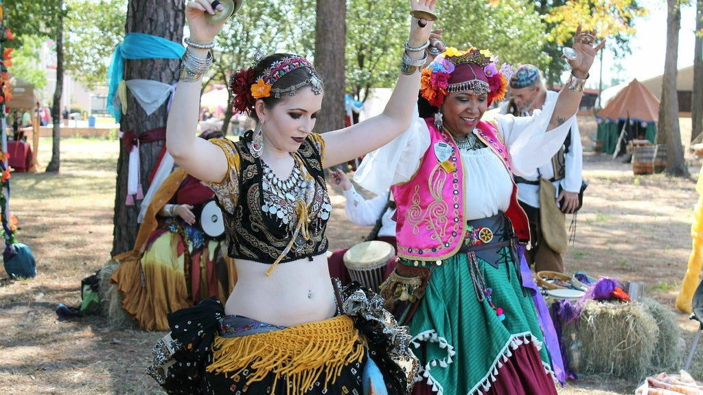 Two gypsy women dancing to traditional music.