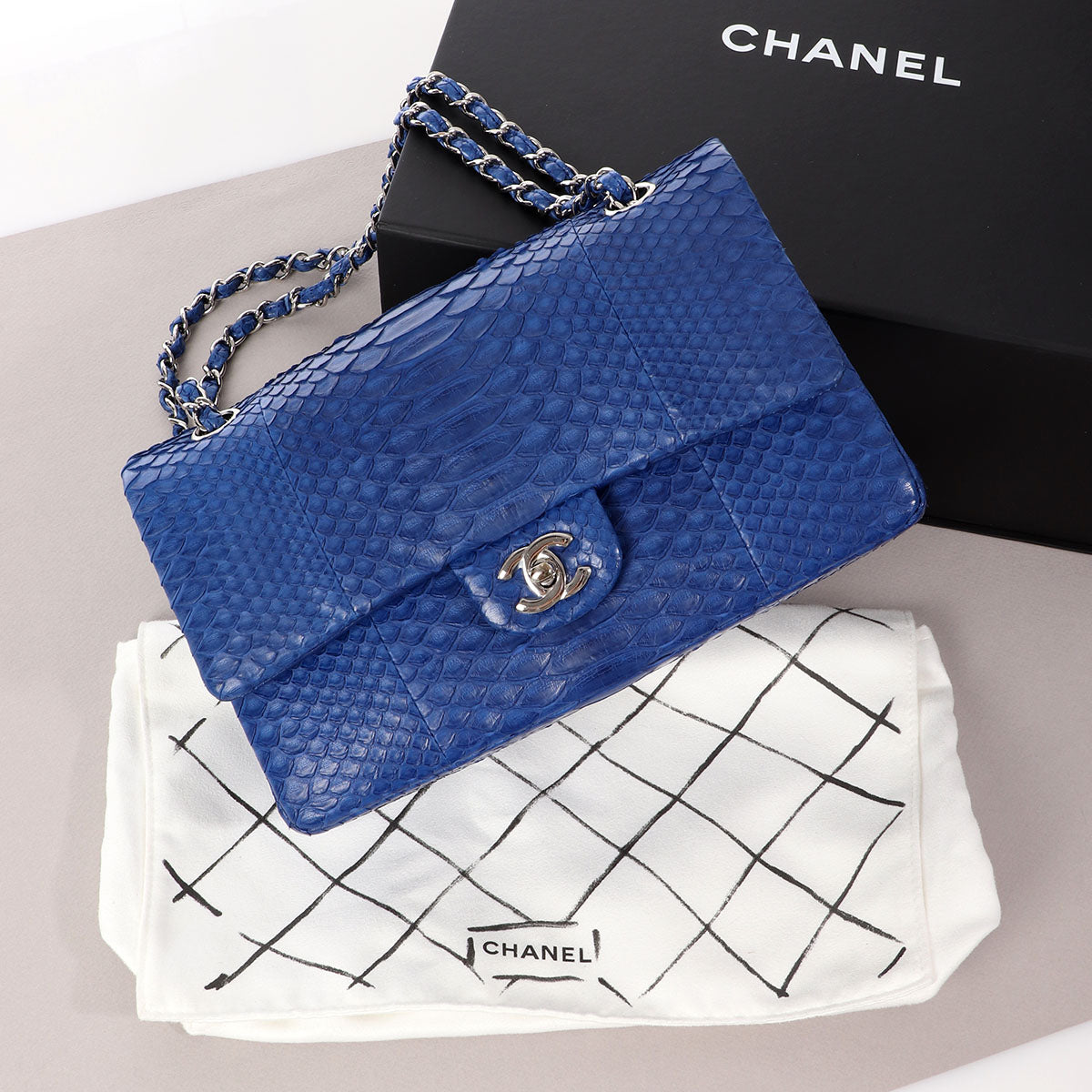 CHANEL CLASSIC FLAP BAG LIGHT PINK PYTHON with interwoven brass and  leather chain matching leather interior flap top with iconic CC turn lock  closure inside sticker 27086028 with box and dust bag