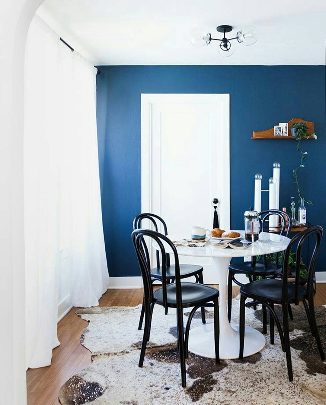 Blue dining room with flushmount ceiling light