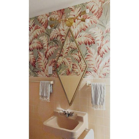 Pastel wallpaper in a 50s pink bathroom