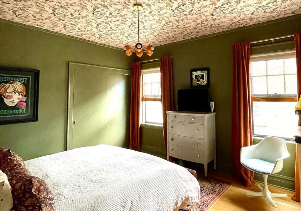 Peach & Brass Loa Carousel Chandelier in a green and peach bedroom with colordrenched walls and ceilings
