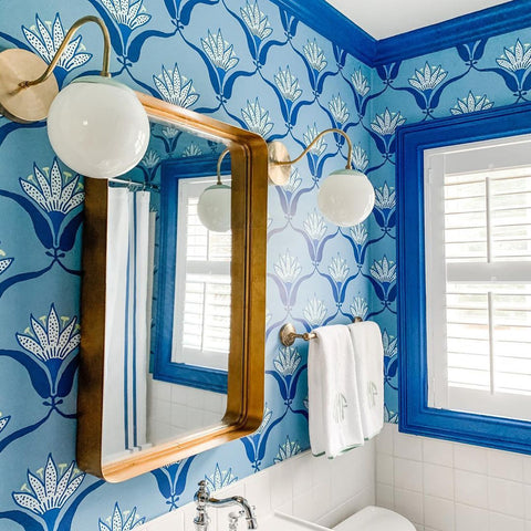 Blue tonal bathroom with Fontainebleau sconces