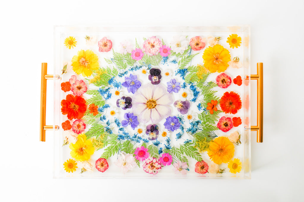 Rainbow floral resin tray made to look like a rainbow kaleidoscope