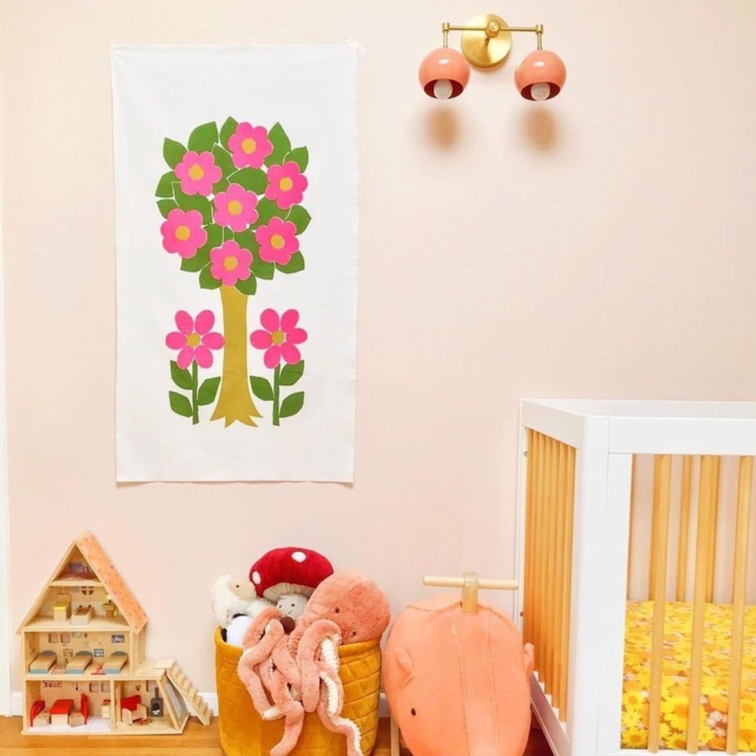 Peach, Pink, and Mustard nursery design with a 60s mod vibe