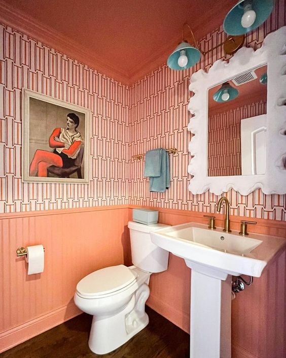 Vibrant Peach Bathroom with teal Vanity Light