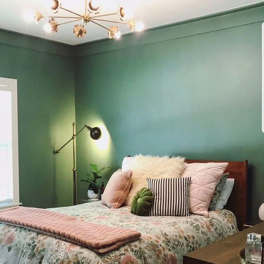 peach and green bedroom with chandelier from sazerac stitches