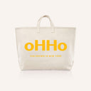 A canvas tote bag with oHHo logo on it in yellow