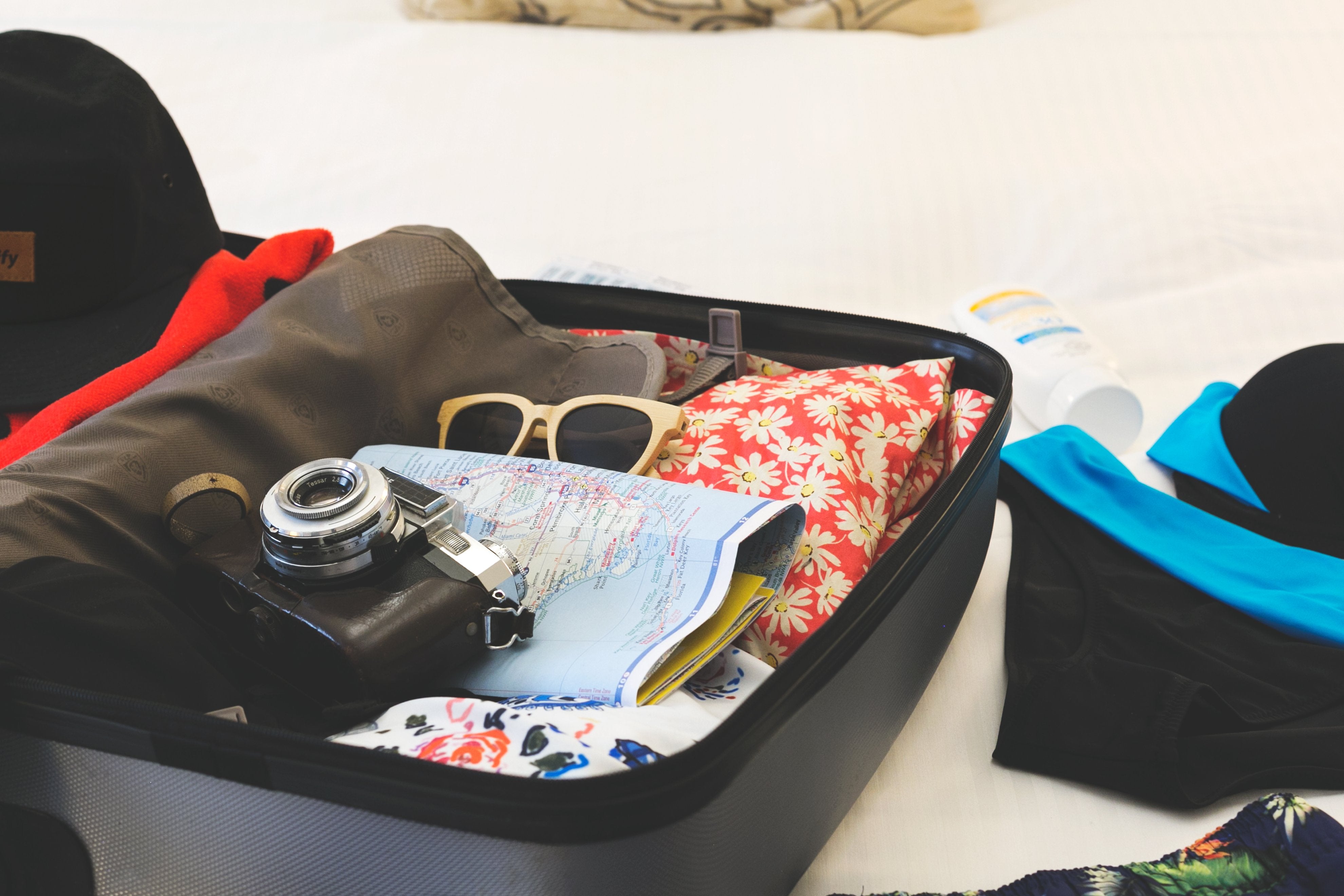 Image showing a suitcase with clothes packed for vacation