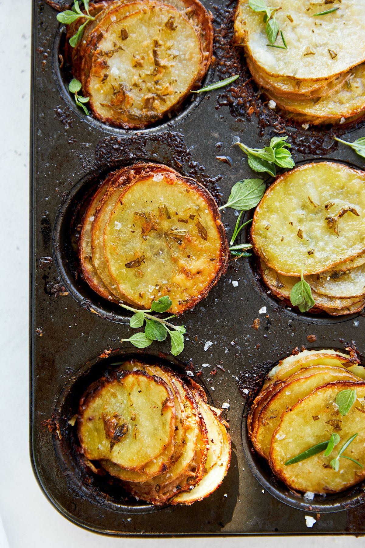 Crispy Cheesy Layered Potatoes made with Herbs and Avocado Oil