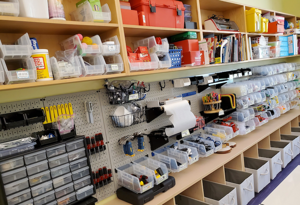 Classroom shelves full of tools for creativity and learning.