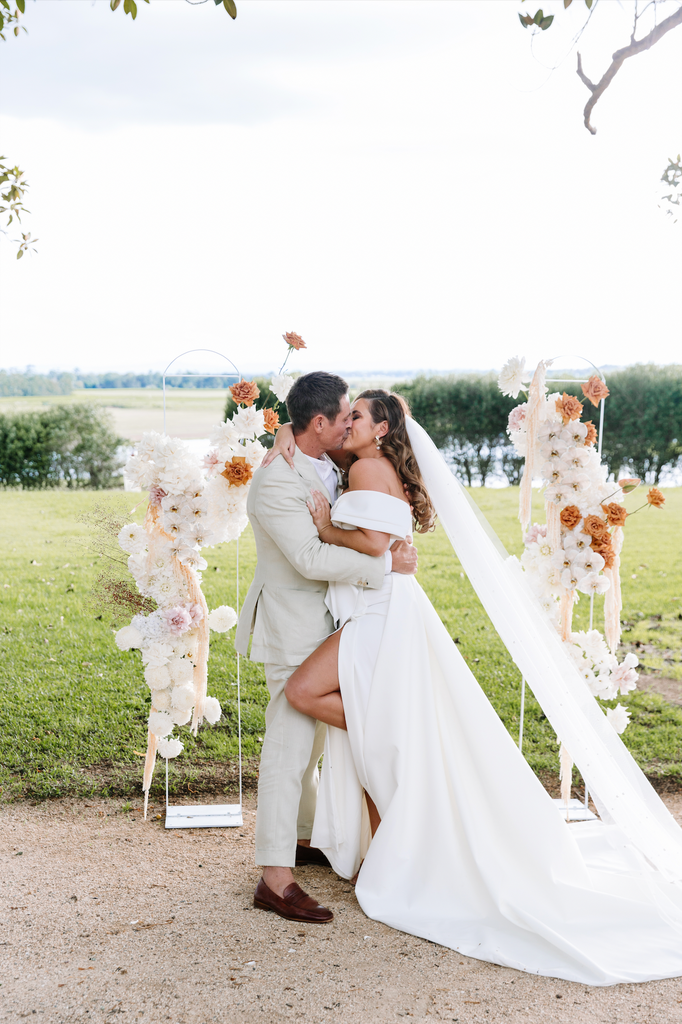 Bride and groom share their first kiss at their hunter valley wedding