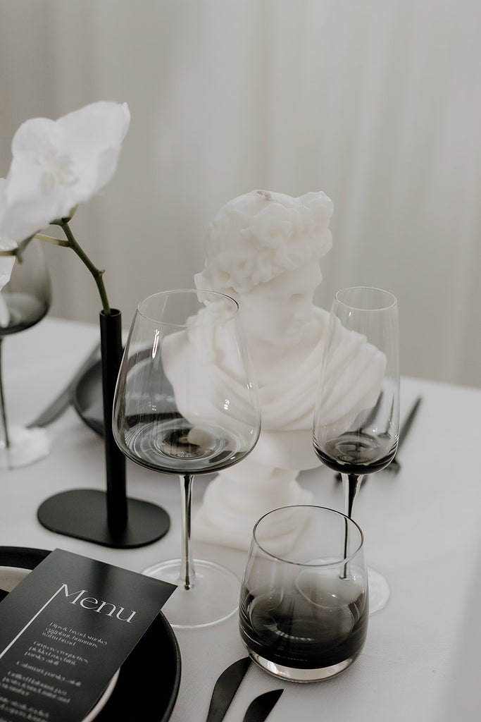 Smoke glassware sits on monochrome styled table