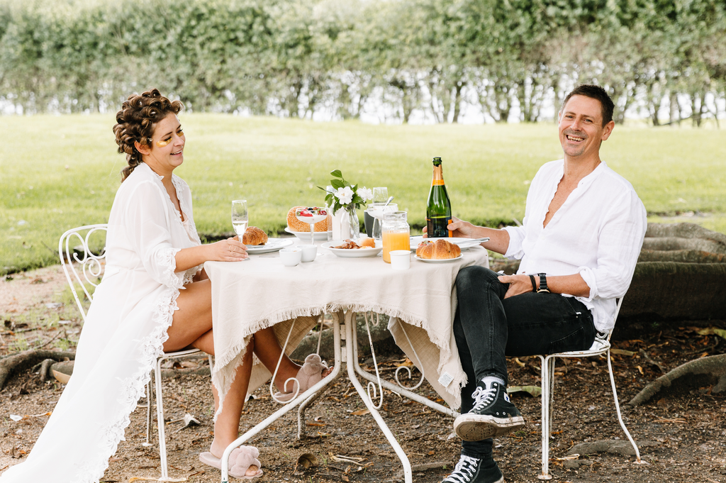 Bride and groom share romantic breakfast on their wedding day in hunter valley garden