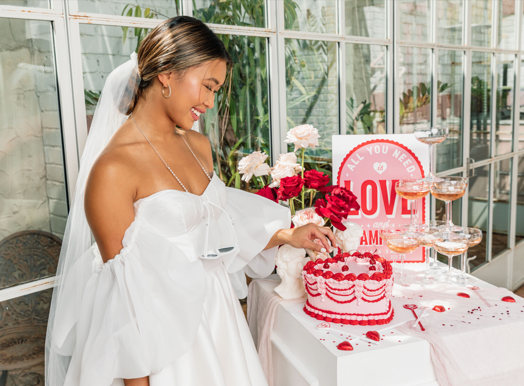 Bride pulls cherry off cake