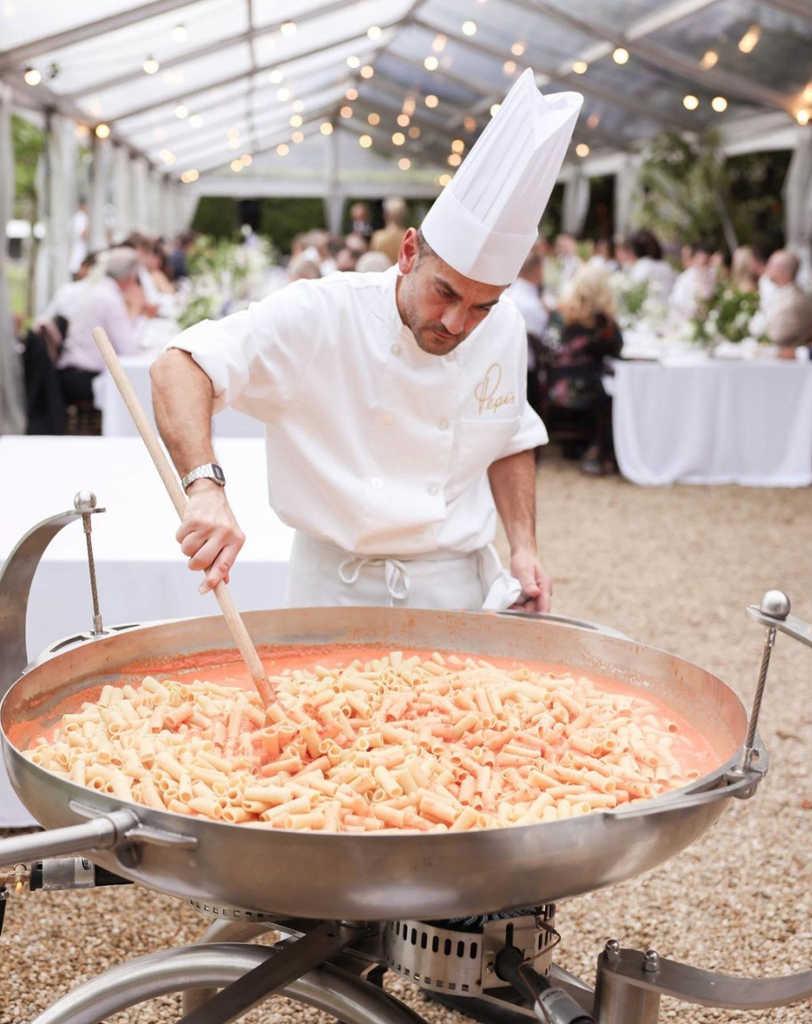 Chef stands behind a Live Pasta Station at a hunter valley wedding.