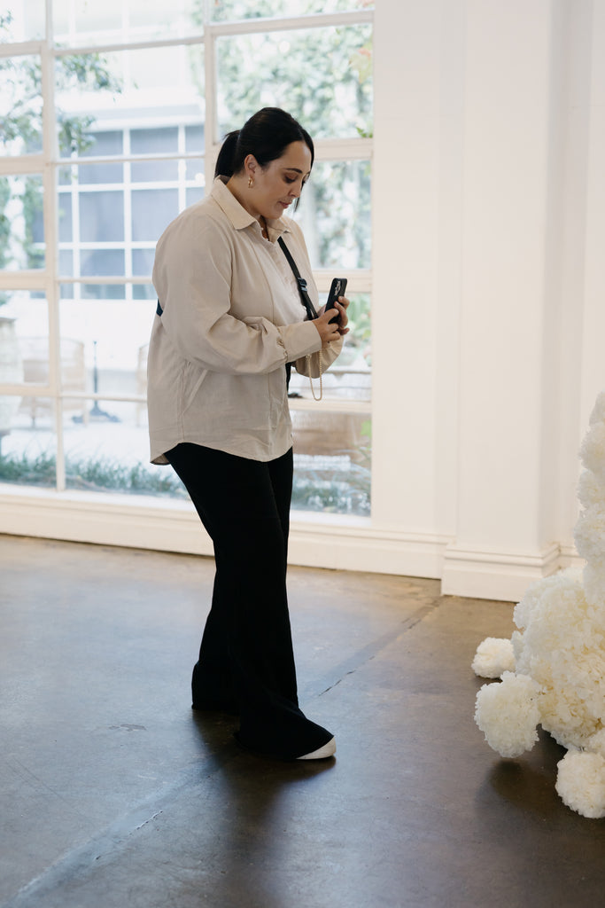 Wedding day content creator Bec from BZ Events and Social Co takes BTS footage of a wedding ceremony
