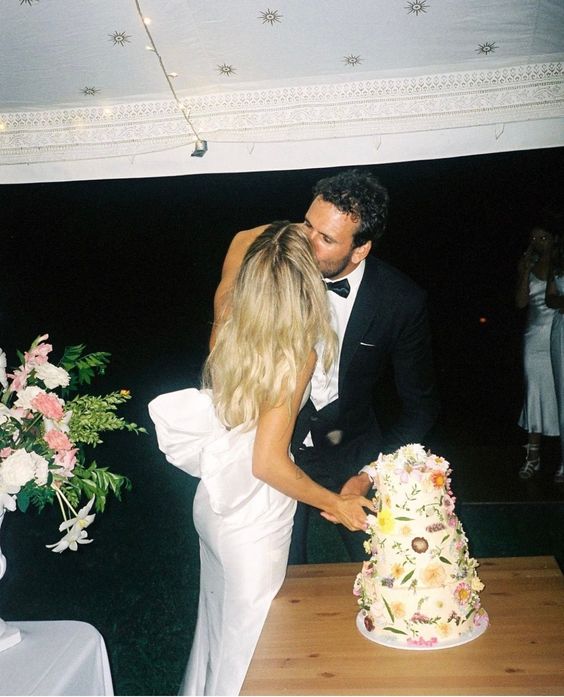 Bride and groom cut flower cake