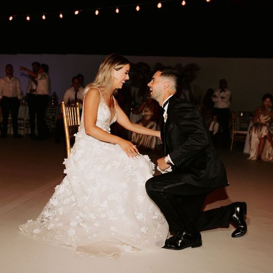 Bride and groom ready for garter toss on their wedding day 