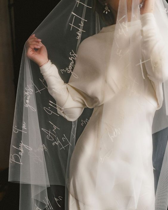 bride wears a trending embroidered veil 