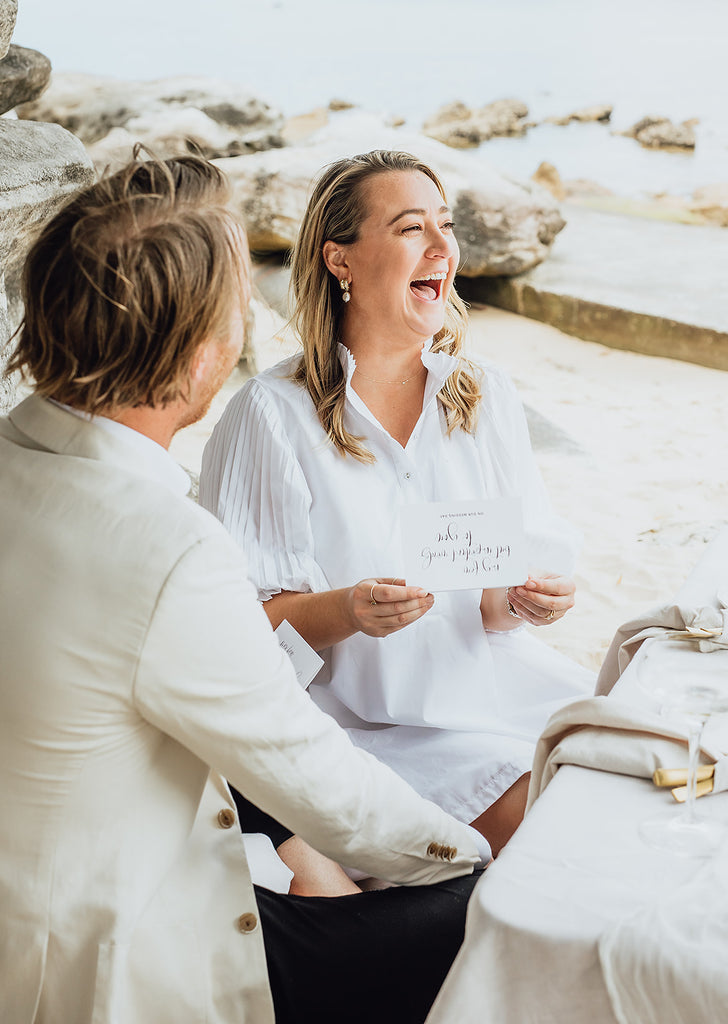 Bride laughs while reading vows 