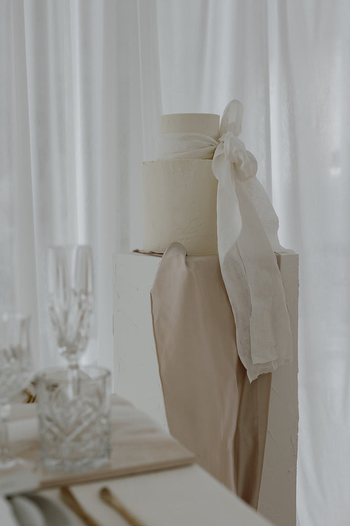 Textured wedding cake with giant bow 