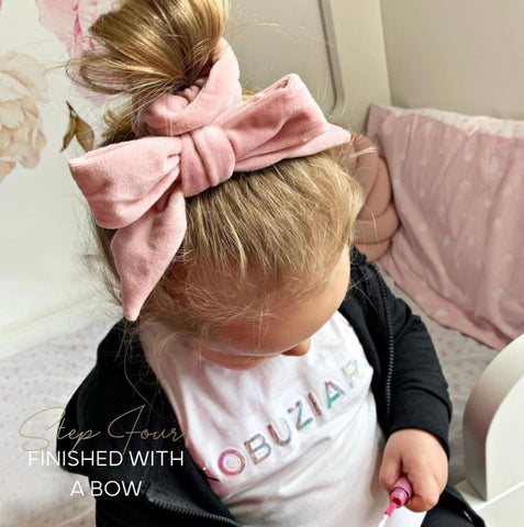 Pop hair into a mini bun with the tiffy & tallulah hair bow!