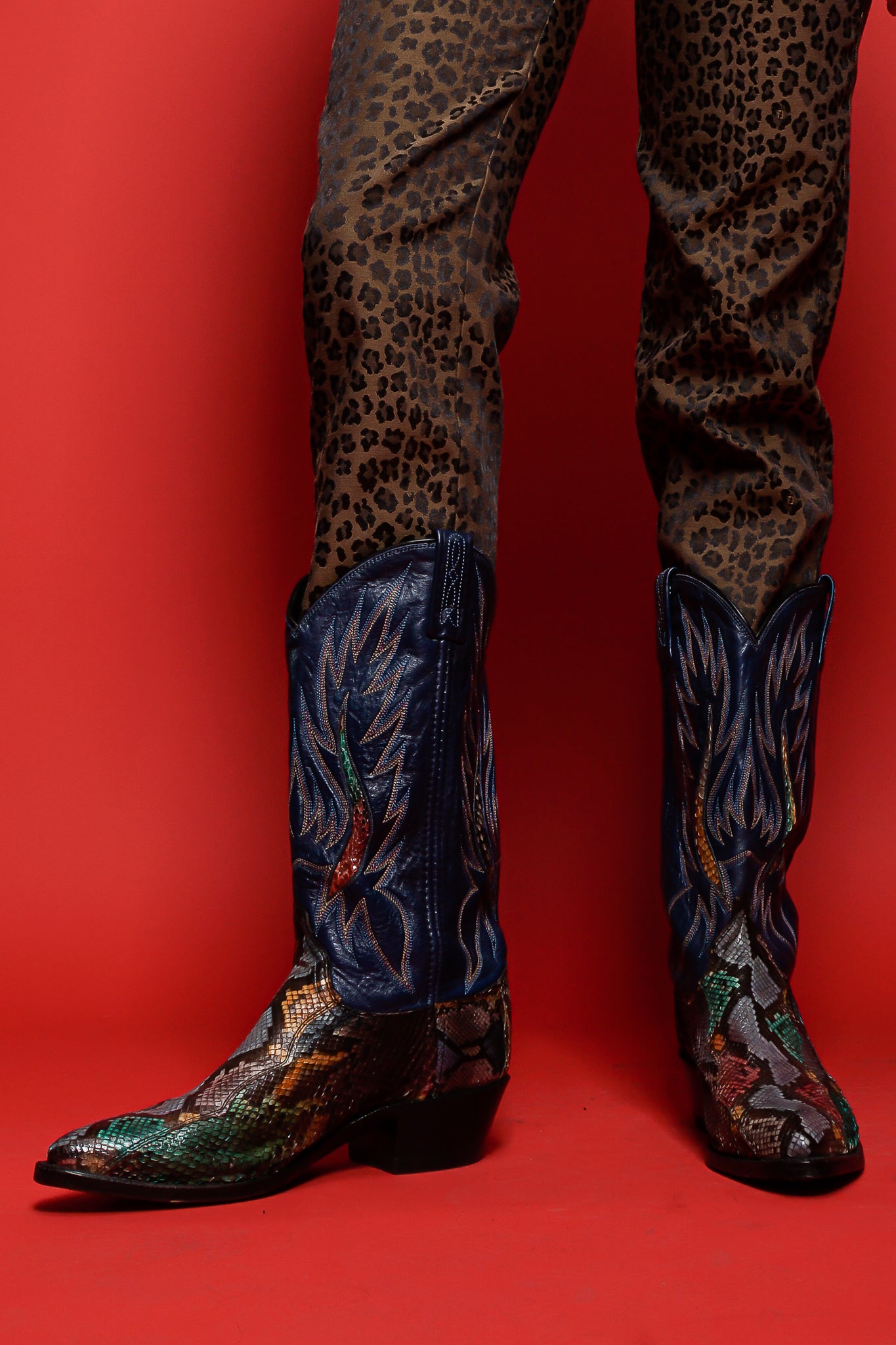 Fendi animal pant and multicolor snakeskin flame boots on red background at Recess Los Angeles