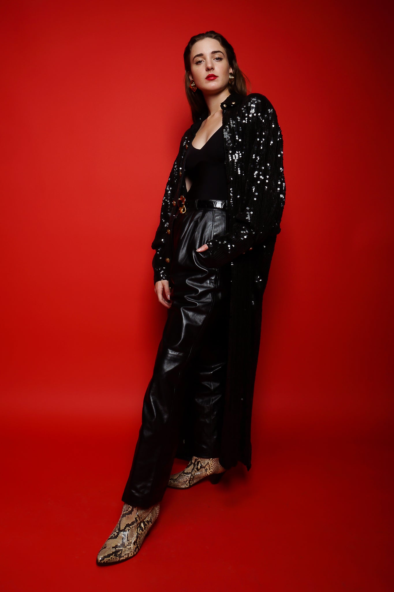 Girl in black Jeanette St Martin sequin duster & YSL leather pant on red at Recess Los Angeles