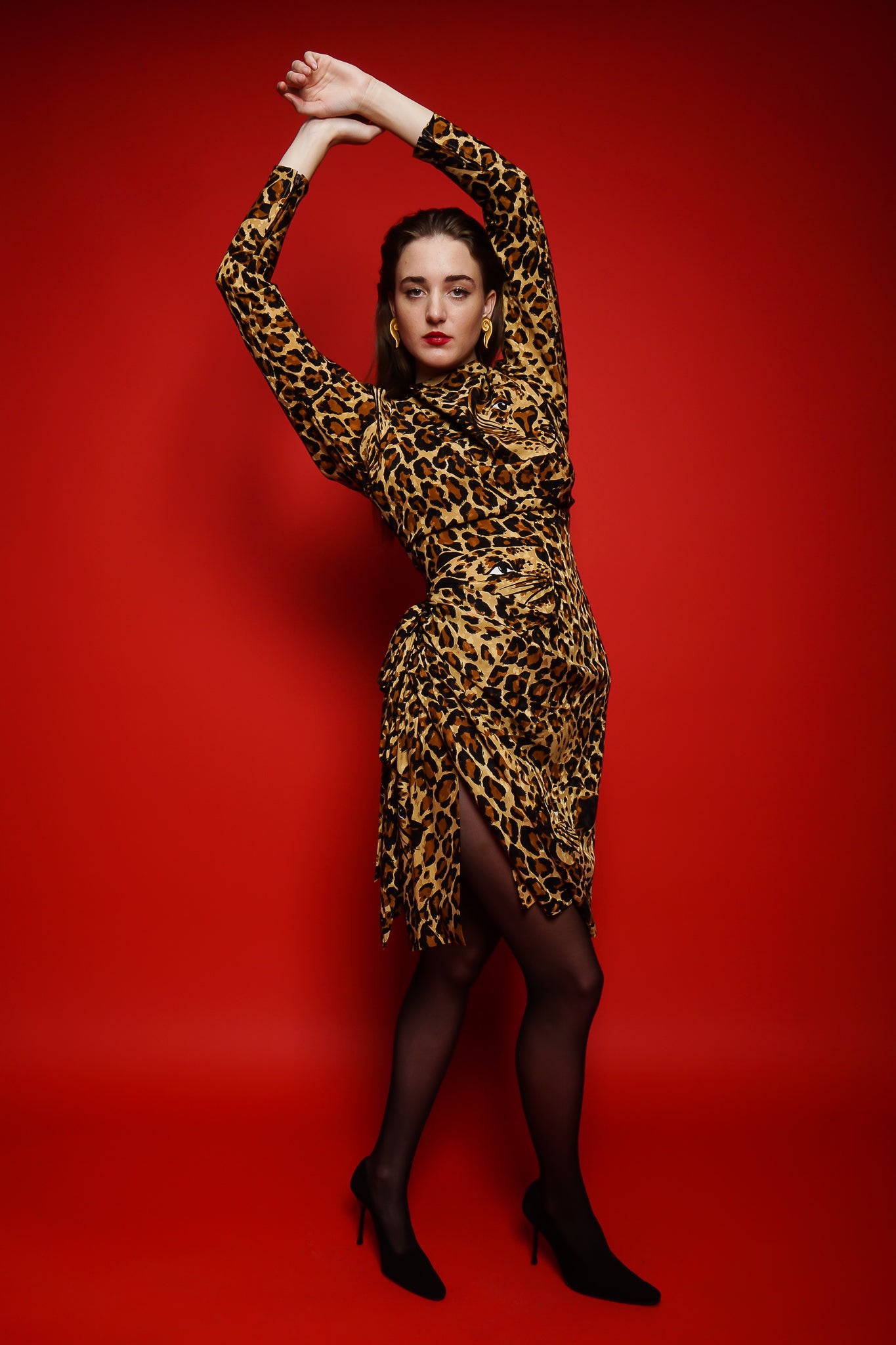 Girl in YSL Yves Saint Laurent Leopard Scarf Dress on red background at Recess Los Angeles