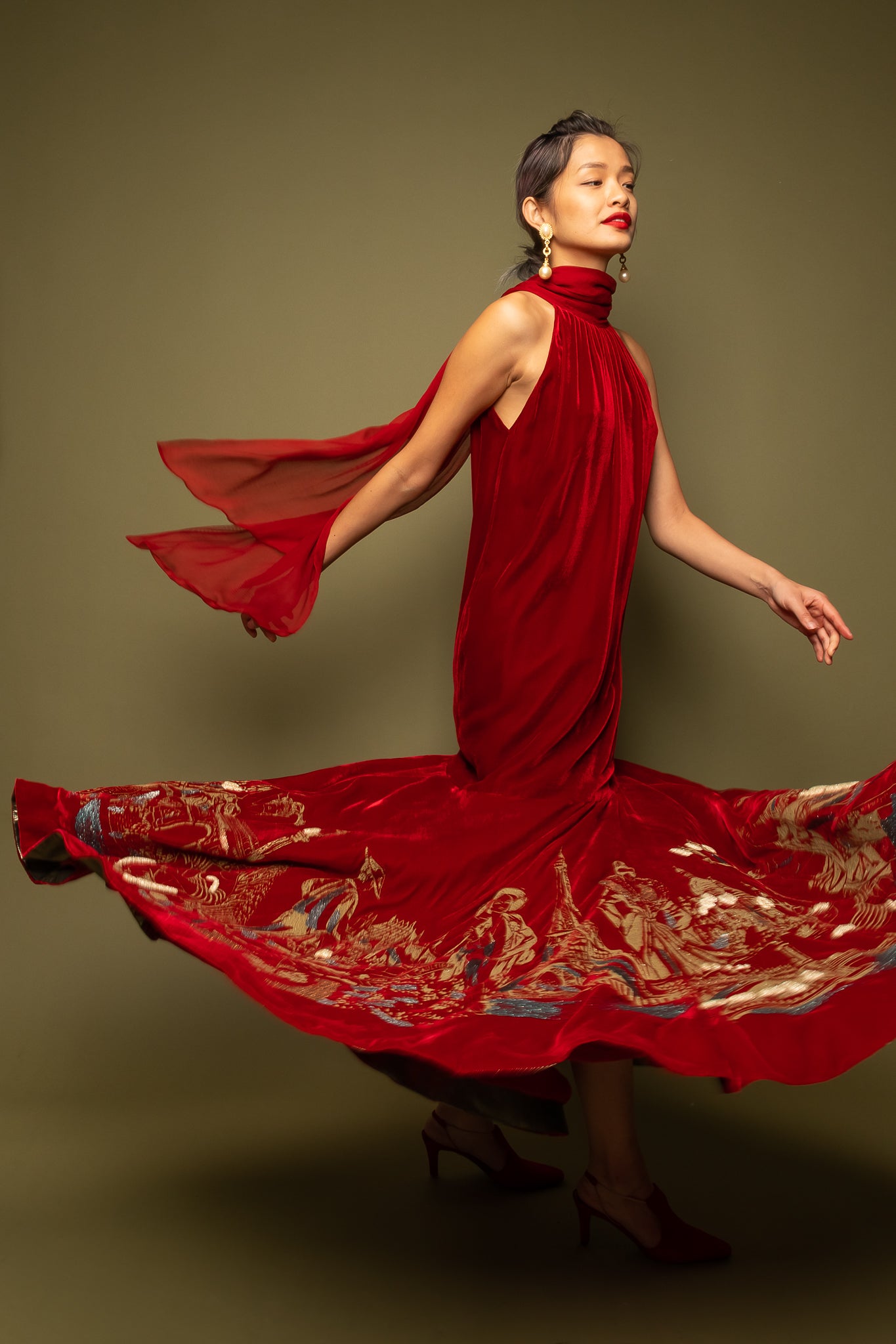 woman wearing red nwt Jean Paul Gaultier velvet glitter mermaid gown on olive @ Recess LA