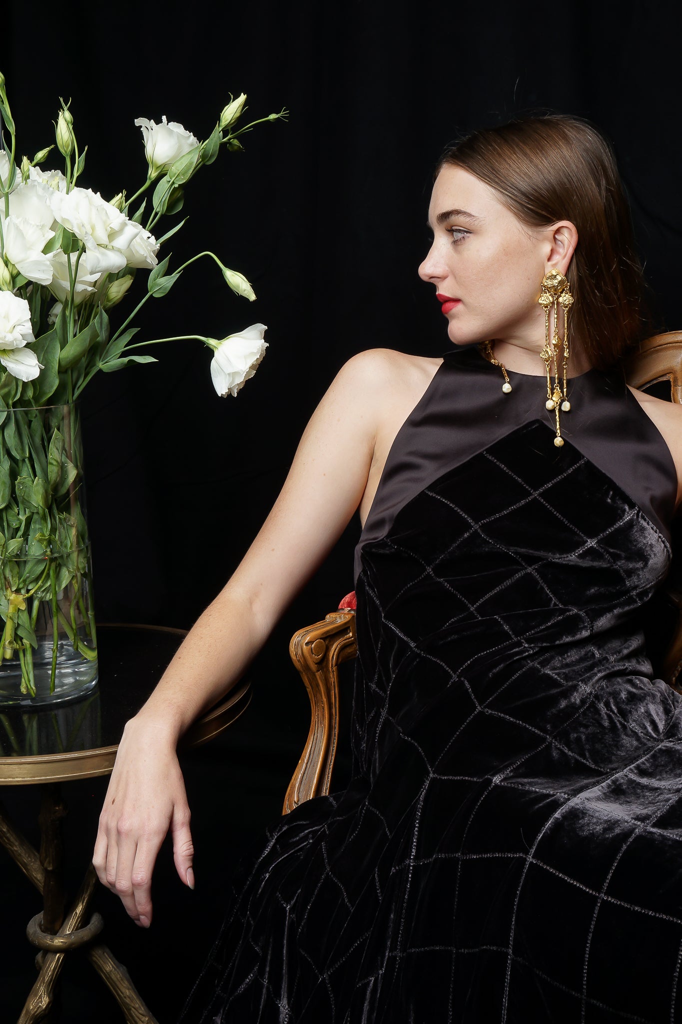 Girl wearing charcoal Calvin Klein gown & Yosca earring at Recess LA Designer Vintage 
