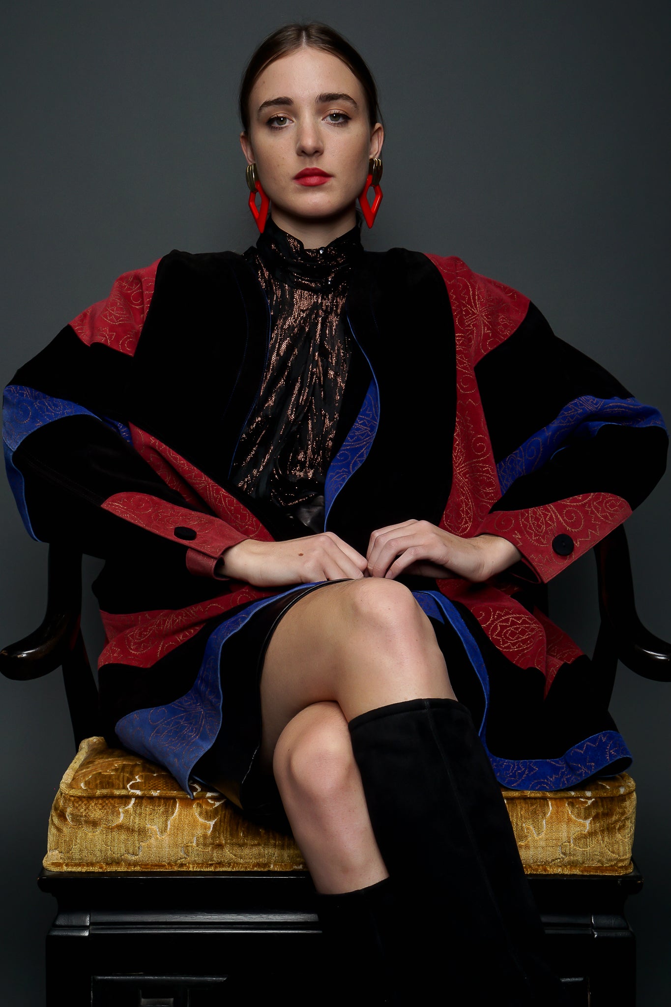 Girl in red/blue Suede Jean Muir Cocoon Coat & YSL leather skirt sitting at Recess LA Vintage