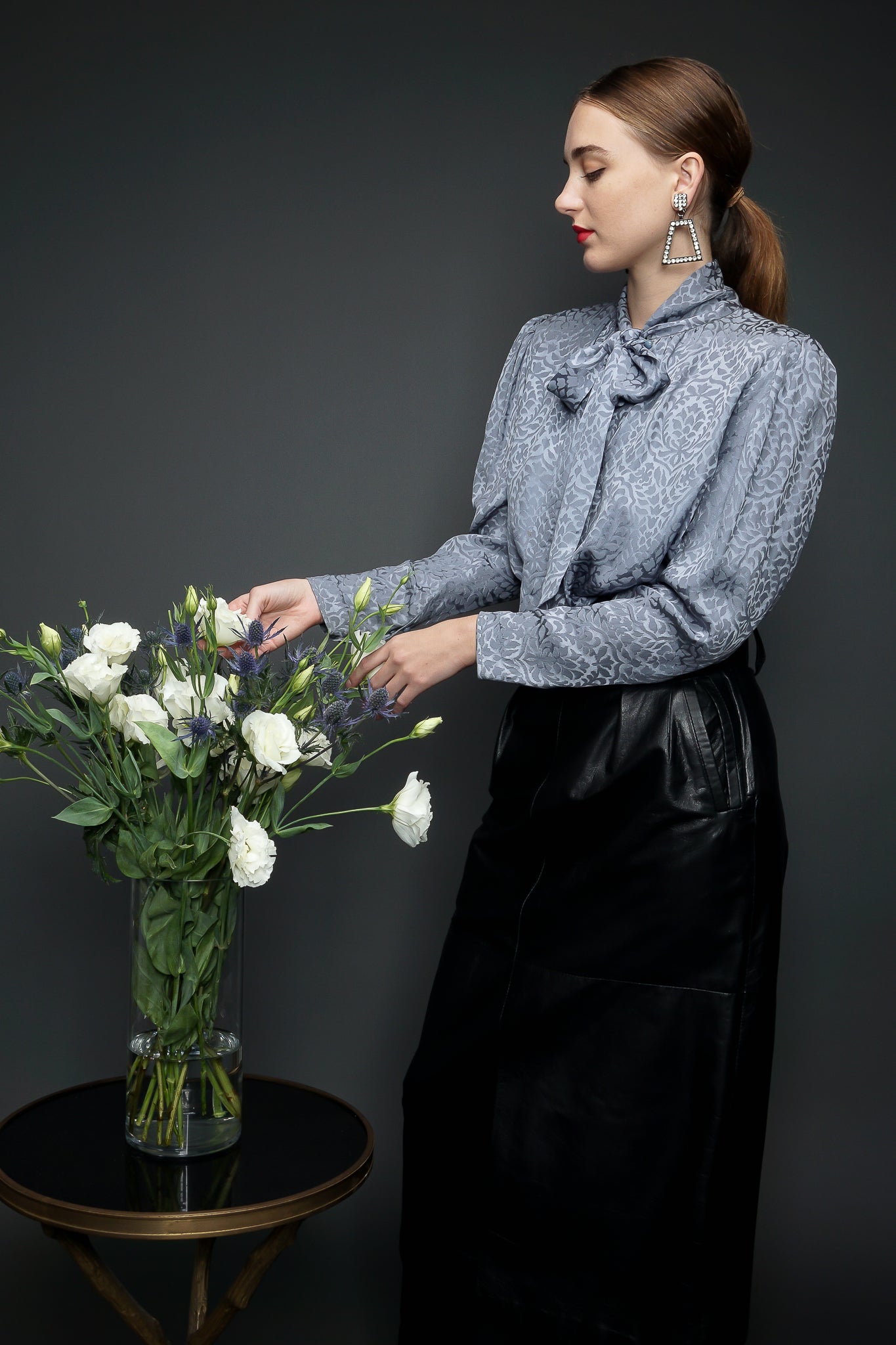 Girl in Yves Saint Laurent YSL Sterling Blouse & Leather Skirt w/ flower at Recess LA Vintage