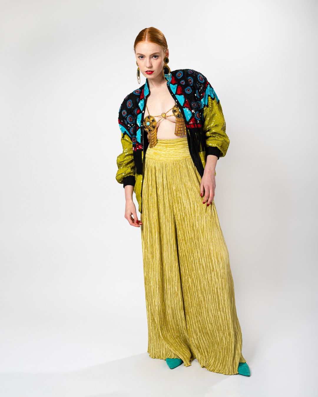 Emily O'Dette in Mary Mcfadden Couture Palazzo Pants, Modi Sequin Jacket, Filigree Medallion Harness
