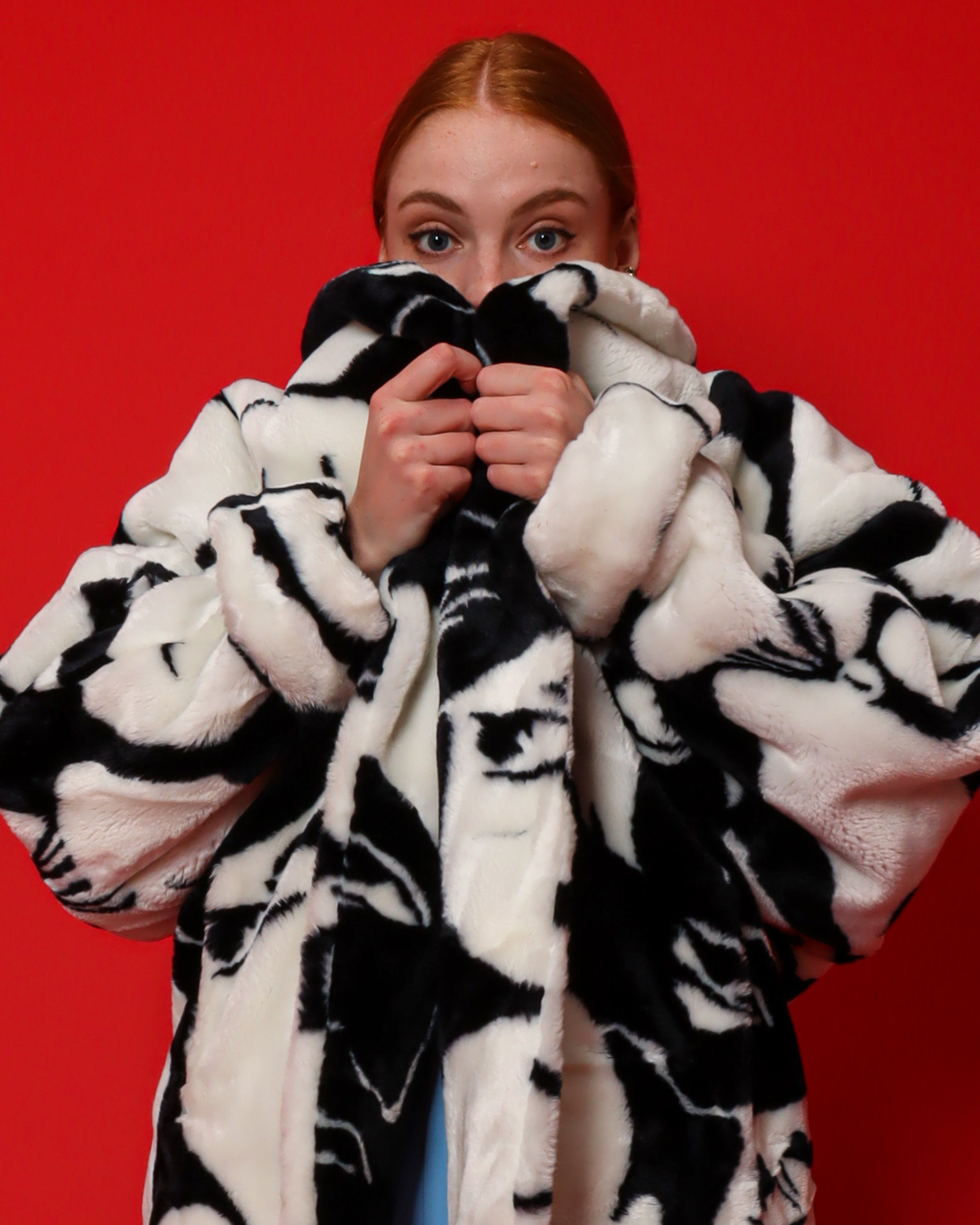 Emily O'Dette in Donny Brooks Abstract Faces Fur Jacket & Jewel Cluster Earrings @ Recess LA
