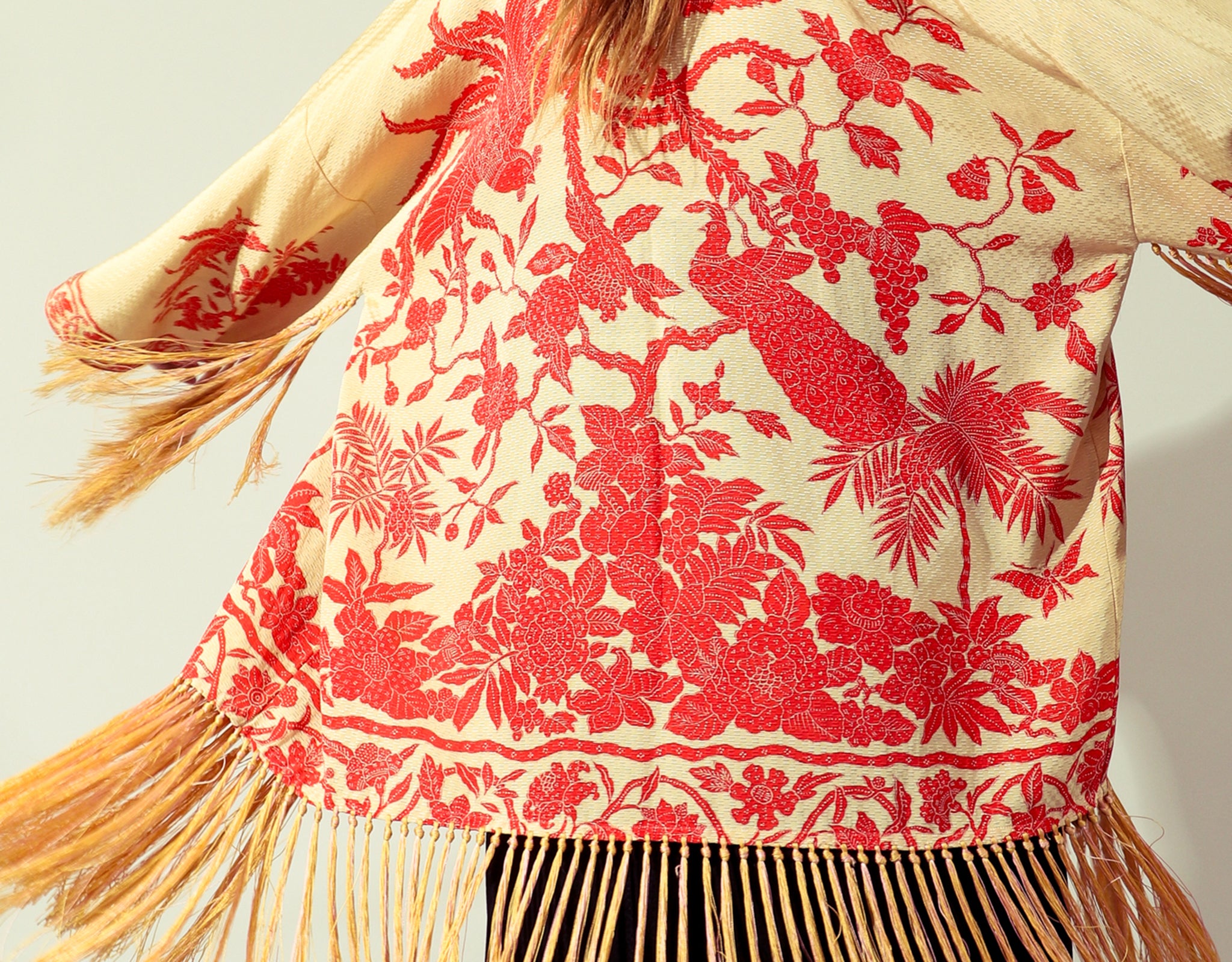 Girl wearing vintage embroidered fringe kimono back view from Recess Los Angeles