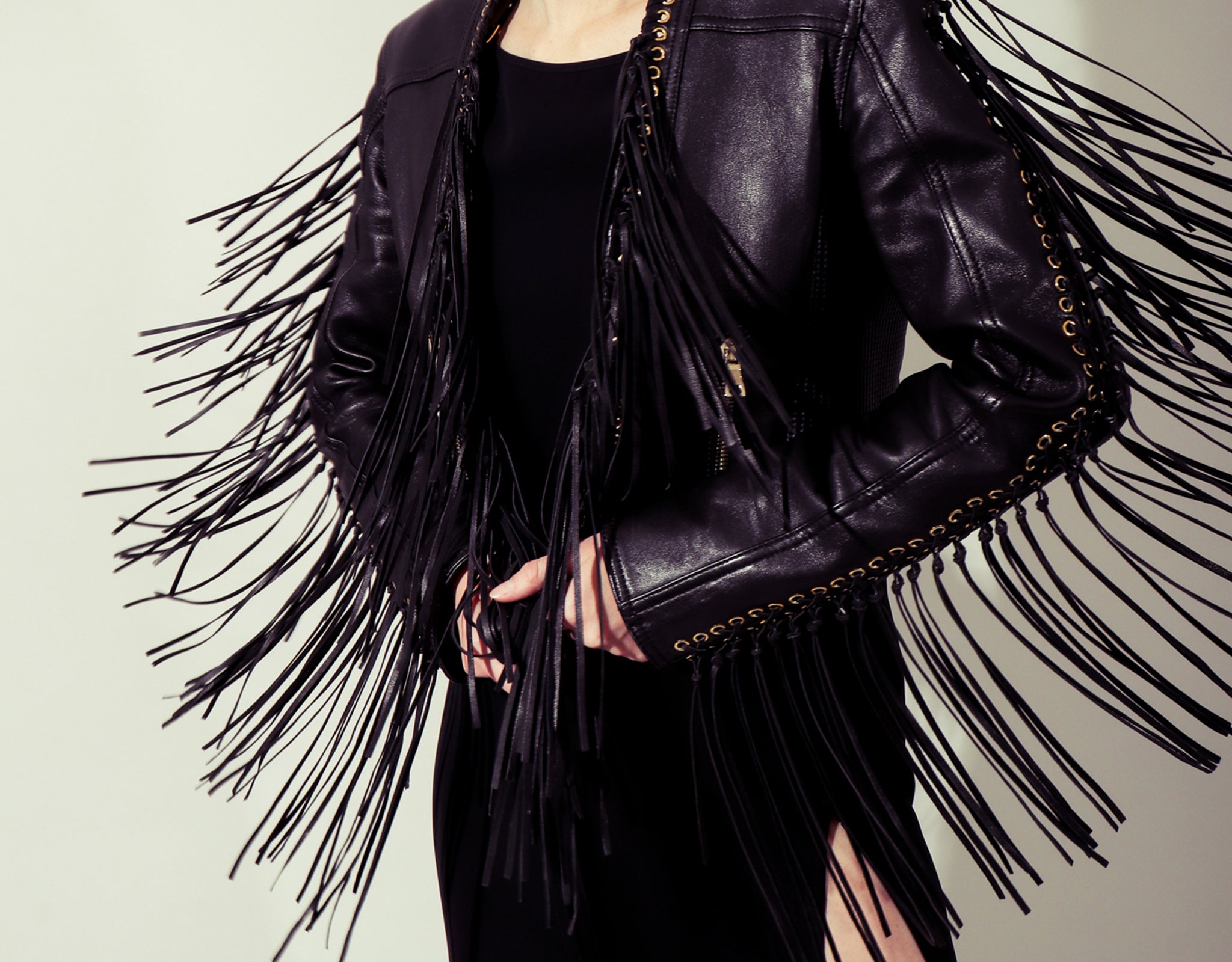 Girl wearing Jean Paul Gaultier Grommet Dress & Balmain Fringe Leather Jacket Recess Los Angeles