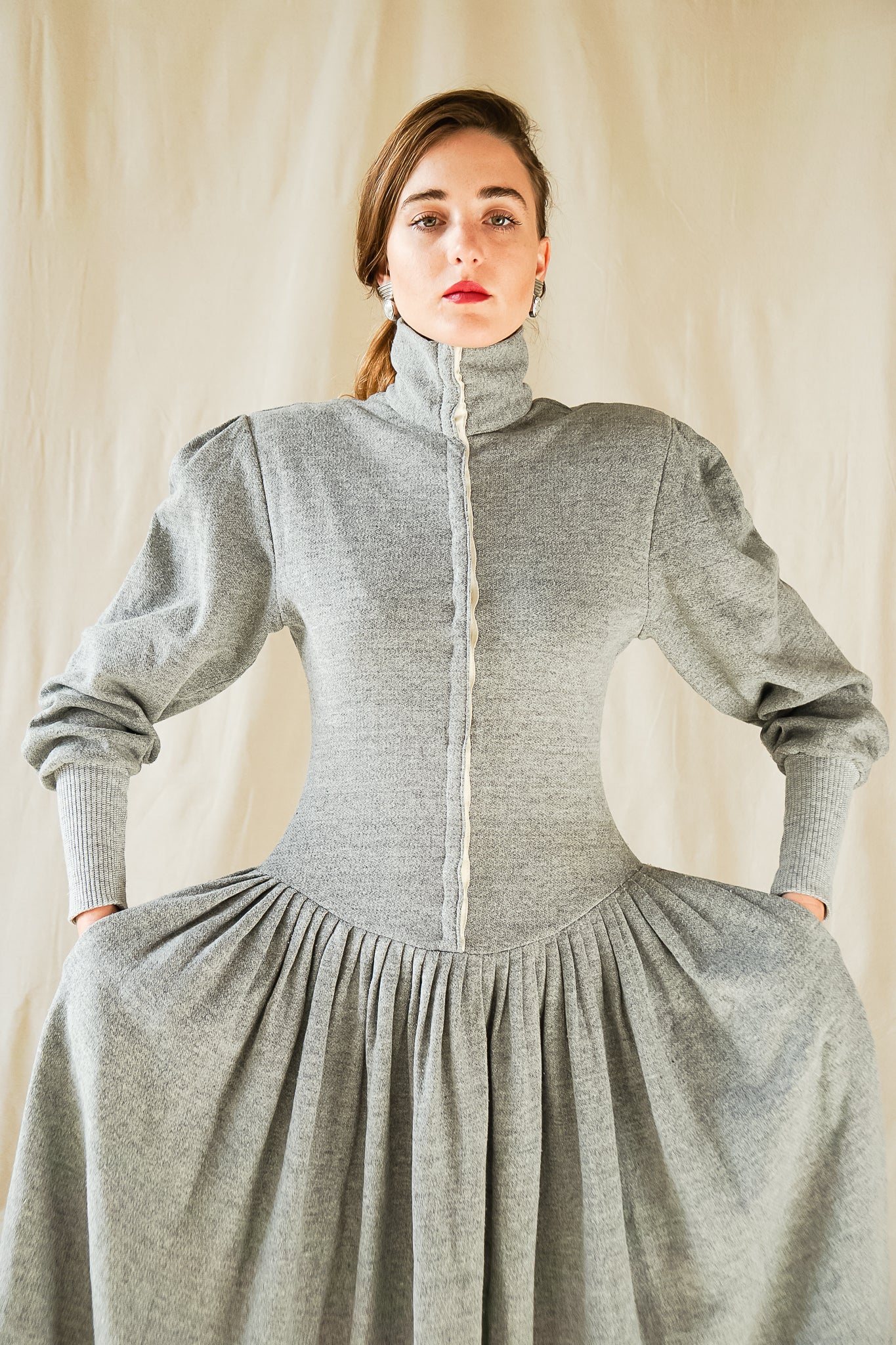 Recess Vintage Consignment Girl wearing grey Norma Kamali iconic 80s sweatshirt fleece dress