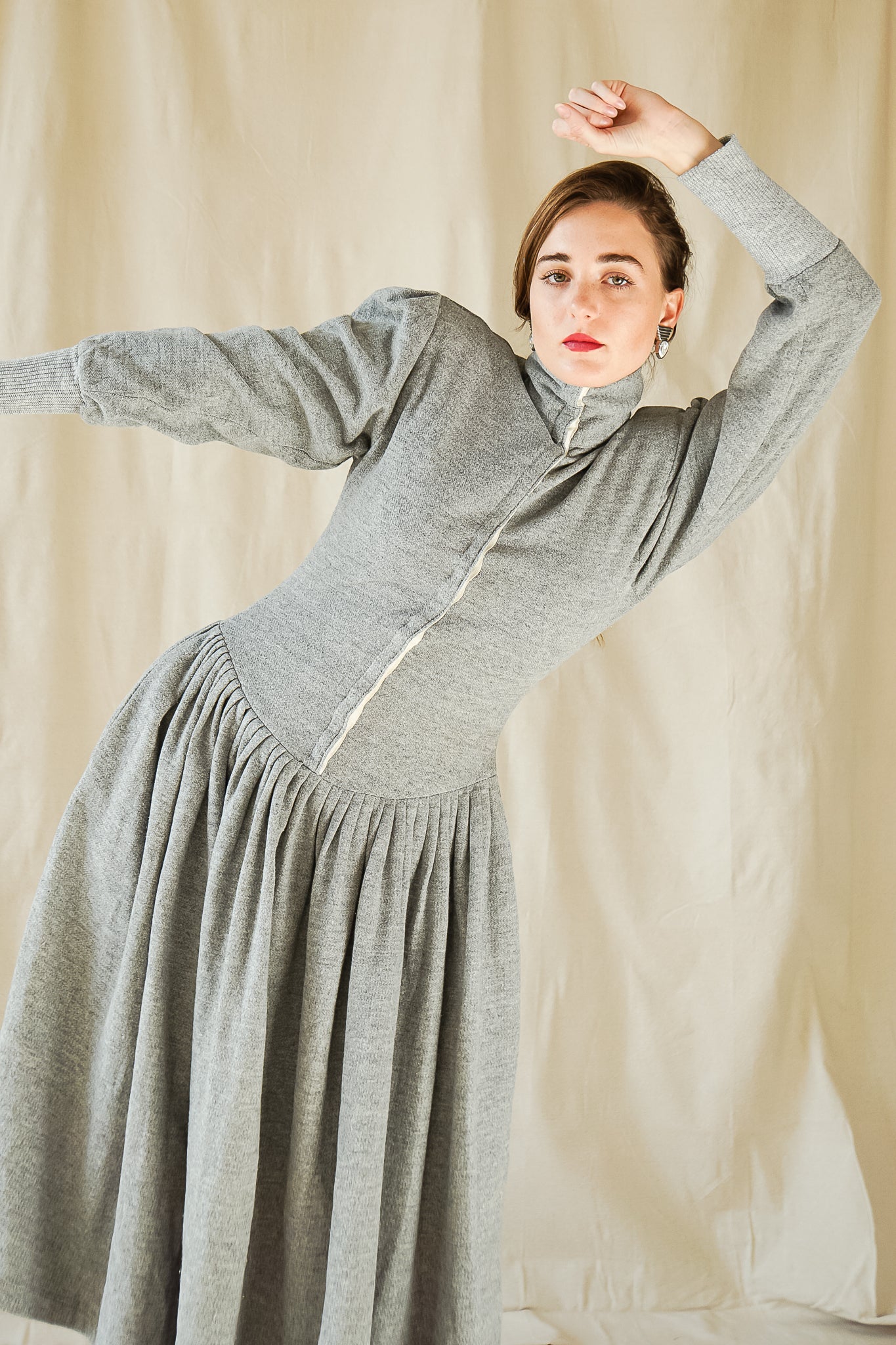 Recess Vintage Consignment Girl wearing grey Norma Kamali iconic 80s sweatshirt fleece dress