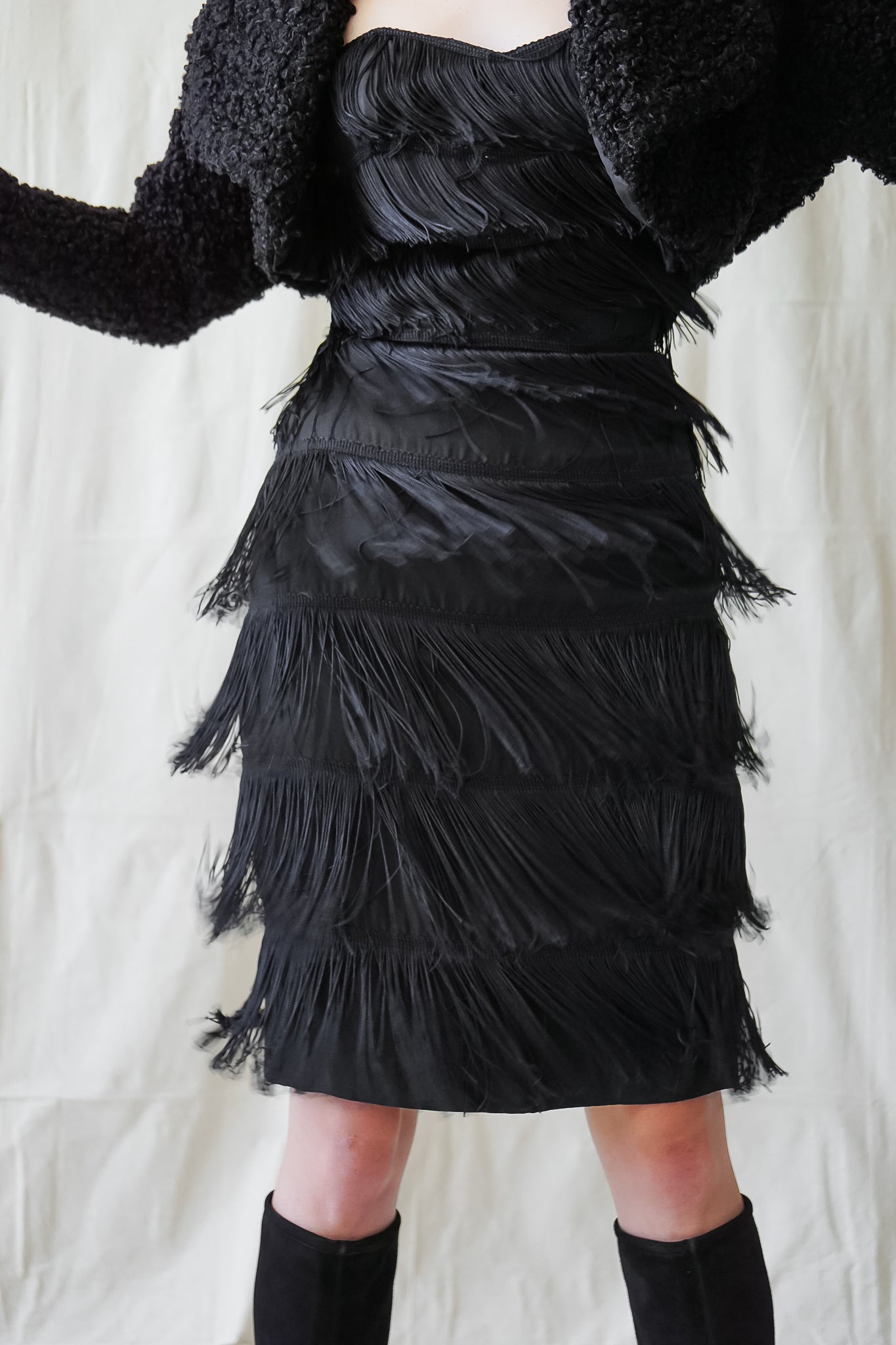 Recess Vintage Los Angeles Girl in Norma Kamali black fringe cocktail dress & faux fur shrug jacket