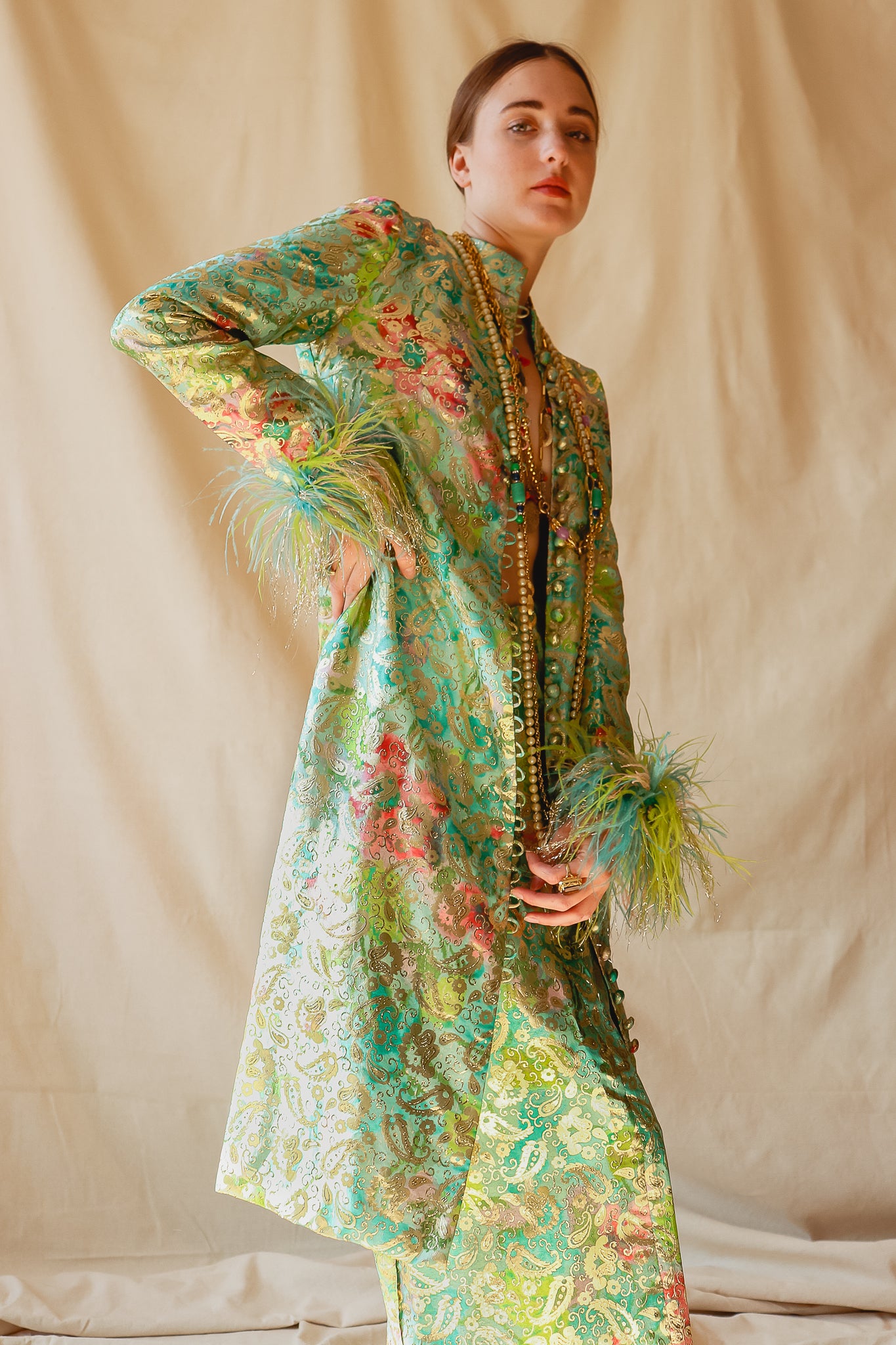 Recess Vintage Consignment Girl in green brocade Victor Costa feather jacket set