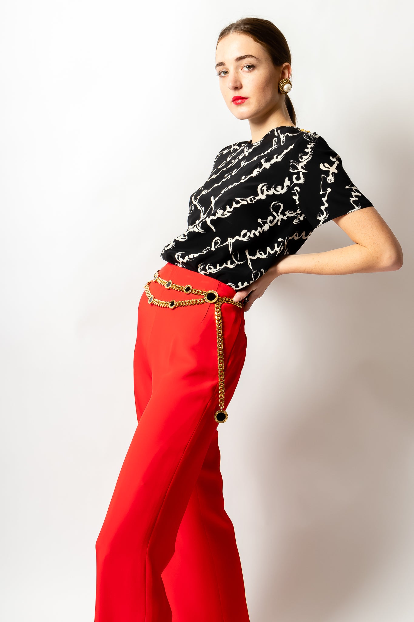 Girl wearing Chanel silk script tee shirt blouse & Oscar de la Renta red pant @ Recess LA