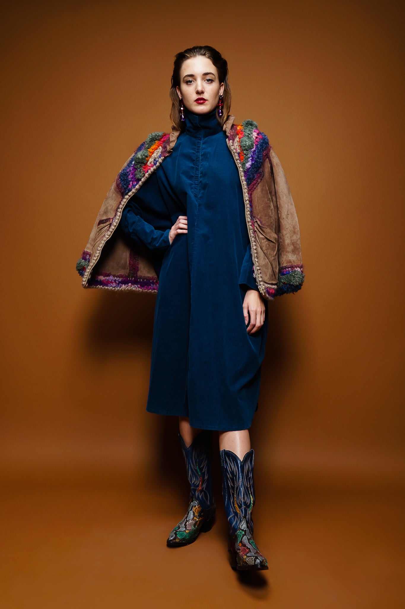 girl in Norma Kamali corduroy dress & Norma Canada crochet jacket on brown @ Recess Los Angeles