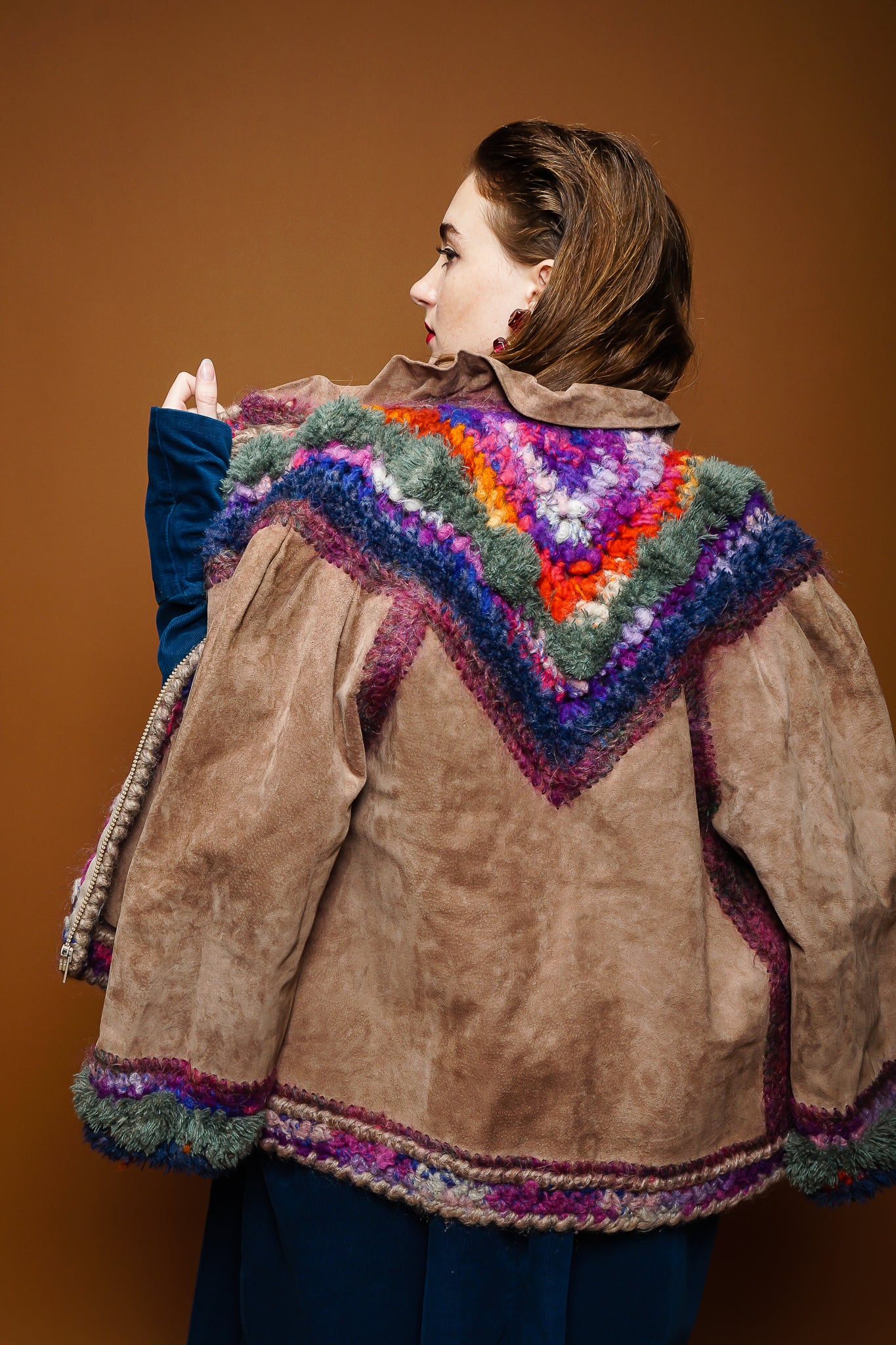 girl in Norma Kamali corduroy dress & Norma Canada crochet jacket on brown @ Recess Los Angeles